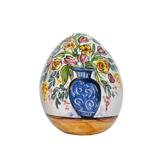 Uovo in ceramica con vaso fiori
